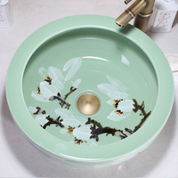 Fregaderos de baño de cerámica de flor de ciruelo redondo pintado a mano con arte sobre encimera verde esmaltado a la venta