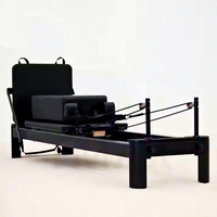 Machine de Pilates Reformer en aluminium noir, portable, pour usage en studio, lit de fitness en alliage d'aluminium