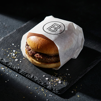 Papier d'emballage alimentaire personnalisé écologique et recyclable avec revêtement PE imperméable et résistant à la graisse pour les en-cas, les hamburgers et le chocolat