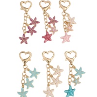 Nouveau porte-clés créatif en alliage de zinc, pendentif étoile de mer coloré, fermoir en forme de cœur, petit cadeau pour femme