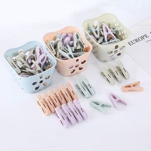 Pack of 30 <b>small</b> <b>plastic</b> clothes clips with storage <b>basket</b>; windproof clips for underwear and socks. - Product Image 1