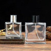 Flacon de parfum rectangulaire transparent de luxe vide de 50 ml en verre gravé à l'acide avec bouchon à vis, vente en gros