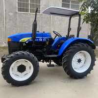 Tracteur à roues Shanghai Holland 804 d'occasion, 4x4, 80 CV, moteur diesel 4 cylindres, boîte de vitesses, cabine fermée, bleu noir, 2000 heures de travail
