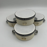 Vente en gros du tambourin en peau de mouton simili de 4 pouces, le plus vendu, pour l'accompagnement Orff et comme cadeau de mariage, à prix très raisonnable.