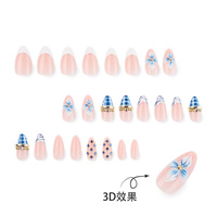 Vente en gros de faux ongles bleus à motifs floraux |   Base nude personnalisable avec imprimé zèbre et strass bleus, faux ongles élégants réutilisables