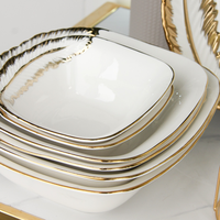Service de vaisselle à bord doré, luxe d'inspiration européenne, bols et assiettes en céramique blanche avec accents dorés