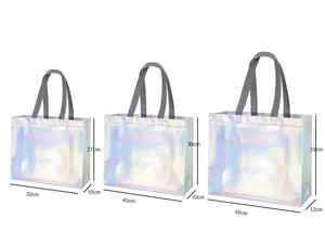 Bolsa láser metálica no tejida personalizada de Bajo Moq, bolsas de mano no tejidas reutilizables de polipropileno, bolsa de compras de tela