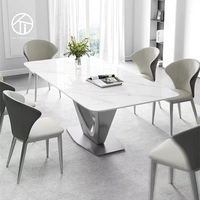 Ensemble de table à manger rectangulaire de luxe moderne avec 4 chaises, capacité de 6 personnes, pour la maison, l'hôtel ou la villa, plateau en pierre frittée, design contemporain