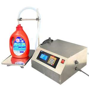 Machine de remplissage et de pesage numérique compacte pour la distribution à petite échelle de liquides corrosifs et de produits de nettoyage quotidiens - Product Image 1