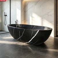 Baignoire autoportante ovale en marbre noir naturel sculpté à la main YOUFINE pour salle de bain de villa moderne