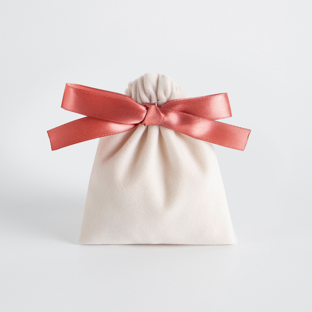 Bolso beige con cinta naranja