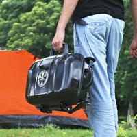 Barbecue portable moderne en fer noir avec double grille et poignée pliable pour le camping