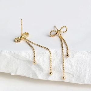 Xinfly Simple Fashion Bow Tassel Earrings 18K Gold Lace Plain AU750 Earrings for Women for Parties and Trendy Style - Product Image 3