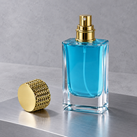 Flacon de parfum rectangulaire en verre personnalisé de 50 ml avec base épaisse et capuchon doré texturé pour l'emballage de parfums