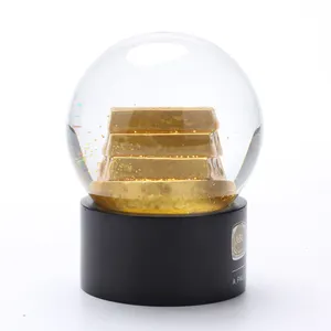 Factory Supplier Creative Custom Resin Gold Luxurious Chocolate Cheap Glass Snow Globe
