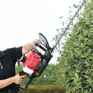 ماكينة تشذيب الحدائق من الدرجة الصناعية تعمل بالبنزين ماكينة تشذيب الحدائق بشفرة مزدوجة ماكينة تشذيب محمولة لقطع أوراق الأشجار والأعشاب - Product Image 1