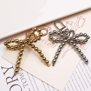 อุปกรณ์เสริมพวงกุญแจรูปโบว์ไข่มุกแสนหวานจี้หรูหราระดับไฮเอนด์ทันสมัยใหม่ - Product Image 1