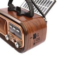 Support de téléphone sans fil multifonctionnel pour radio et audio à chargement solaire Caisson de basses portable de haute qualité Rétro BT Mini Haut-parleur d'extérieur