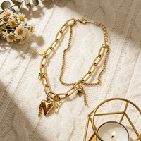 Bracelet Novirassine en acier inoxydable plaqué or 18 carats pour femme, chaîne gourmette épaisse avec breloque cœur et fermoir à bascule, vente en gros de bijoux