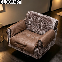 Fauteuil pivotant de luxe en cuir mélangé, rembourré de plumes, avec base pivotante en carbone noir mat
