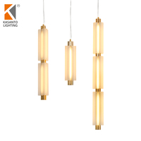 Lustre moderne de petite taille Rakumba Metropol Sebastian Herkner, suspension en verre et fer avec pendentifs en verre