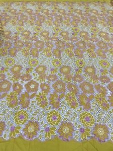 Tissu de broderie creux de luxe en dentelle de chrysanthème en stock du fabricant pour robes traditionnelles et sexy - Product Image 3
