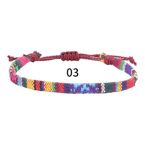 Pulsera <span class=keywords><strong>tejida</strong></span> estilo Nepal para mujer, <span class=keywords><strong>tobillera</strong></span> de cuerda trenzada de algodón multicolor hecha a mano ajustable - Product Image 1