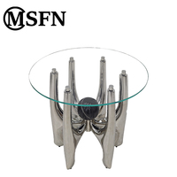 Table à manger moderne avec base ronde en acier inoxydable, plateau en verre trempé, accents en marbre noir, pieds en métal durables pour la maison et l'hôtel