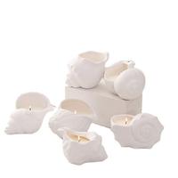 Vente en gros de bougie de luxe en forme de coquille en céramique blanche avec couvercle pour décoration de Noël à la maison cire parfumée