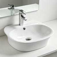 Lavabo ovale semi-encastré facile à nettoyer Lavabo de salle de bain en céramique blanche brillante pour salles de bain minimalistes