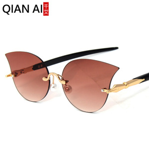 Lunettes de soleil œil de chat Qianai pour femme, verres jaunes océan, protection UV 100%, design irrégulier tendance pour la protection solaire et les voyages - Product Image 2