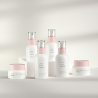 Nouveau design, ensemble d'emballages de soins de la peau de luxe rose, bouteille et pot en verre vides à pompe à lotion, bouteille de crème cosmétique avec pompe en plastique