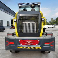 Promotion Chargeuse sur pneus mini 4x4 à direction pivotante, transmission hydrostatique, homologuée Stage V, pour manutention en verger, avec fourches à palettes, contrepoids et cabine