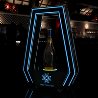 Support d'affichage rotatif pour bouteilles avec éclairage LED en acrylique, logo personnalisé, couleur personnalisée, revêtement UV, pour hôtel, boîte de nuit