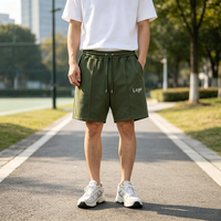 Shorts de survêtement vert olive personnalisés pour hommes avec logo, cordon de serrage, taille élastique, poches avant, style décontracté, athlétique, streetwear