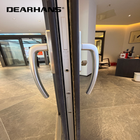 Porte coulissante minimaliste en aluminium mince avec verre isolant transparent pour balcon et extension d'espace de salon