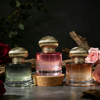 Flacon de parfum en verre rose rond épais de 50 ml, nouveau design, avec bouchon pompe transparent et boîte d'emballage cosmétique ronde verte, vente en gros