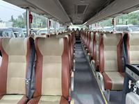 Autocar de tourisme d'occasion en bon état, 50 places, moteur Yuchai, conduite à gauche, pour transport de personnel et services de location