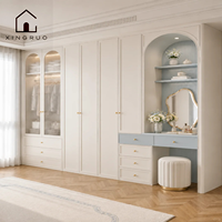 Armoire de rangement XINGRUO bleu crème avec portes cannelées, éclairage LED, coiffeuse et design cintré pour chambre à coucher, style européen