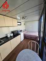 Cabine mobile préfabriquée de style chinois, petite et modulaire, pour camping-car, maison en acier mobile, panneau sandwich, cabine mobile Apple