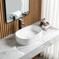 Vasque de salle de bain ovale en céramique de haute qualité, moderne, à poser sur le comptoir