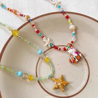 Collier à perles coloré en forme d'étoile de mer orange tendance pour les vacances à la plage et les parcs d'attractions, cadeau mignon pour femmes, chaîne de clavicule