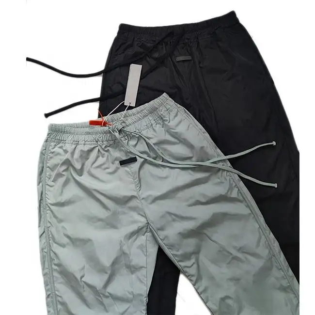 Spring Popular Custom logo printing nylon waterproof pants high quality men windbreaker track jogger pants with mesh lining