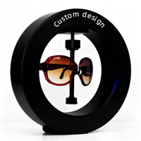 Présentoir à Lunettes Magnétique Flottant Rotatif Moderne en Plastique Poli avec Éclairage LED pour Personnalisation de Design