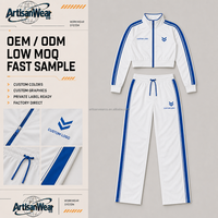 Ensemble décontracté pour homme personnalisé, haut blanc à col montant et fermeture éclair, pantalon large à double bande bleue sur les côtés avec cordon de serrage, OEM ODM