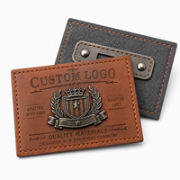 Nouveau design personnalisé en creux étiquette de patch de vêtements en faux cuir PU avec logo en métal 3D personnalisé