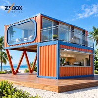 Kiosque de plage modulaire mobile à deux étages en conteneur, prêt à l'emploi, avec murs en verre, pour café, snack-bar, idéal pour les complexes hôteliers et les zones balnéaires.