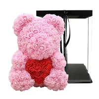 Meilleure vente : Ours en peluche rose artificiel avec fleurs en PE de 25 cm et boîte cadeau transparente