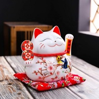 Mignon chat porte-bonheur en céramique blanche délicate et populaire Maneki Neko avec main ondulée pour la décoration intérieure de la boutique