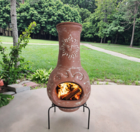 Foyer Chiminea en argile à face solaire de style mexicain avec pieds en métal pour chauffage extérieur